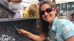 Joanna signing a beam in the Disney Parks