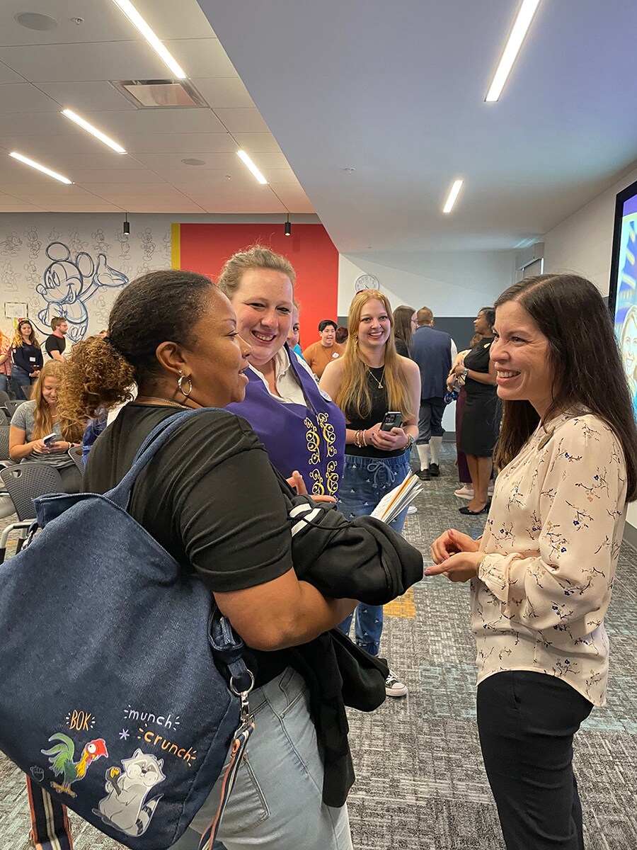 College Program participants smile as they take the opportunity to network with members of the panel.