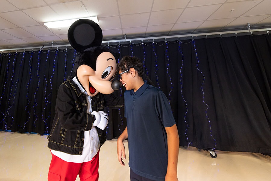 Mickey Mouse Greets Young Student
