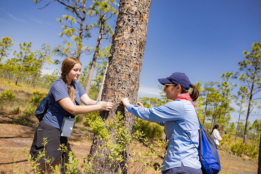 Girl Scout with Disney Cast Member at Disney Wilderness Preserve