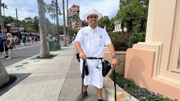 Guillermo smiles in his Custodial costume on Sunset Blvd. at Disney's Hollywood Studios.