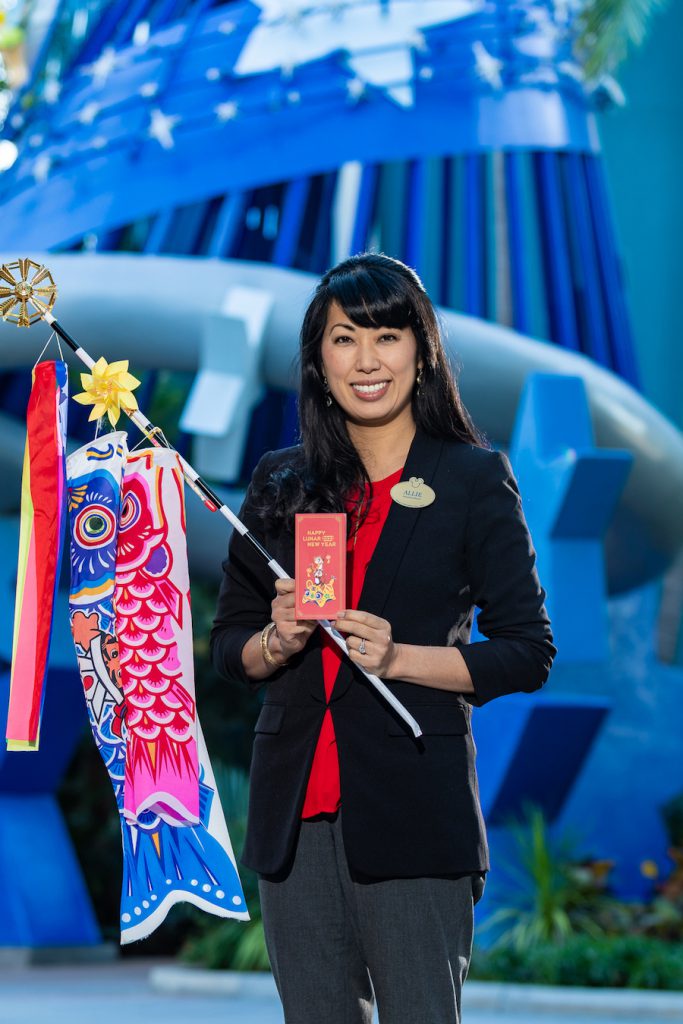 Allie holds the red key envelope for Lunar New Year