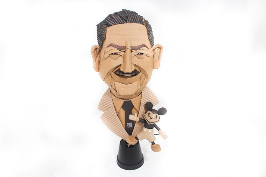 Bust of Walt Disney with a small Mickey Mouse made from recycled cardboard