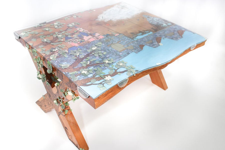 A table with an inlaid portrait of Sleeping Beauty Castle