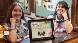 Jodi and Katherine with their Environmental Art Challenge certificate and plaque