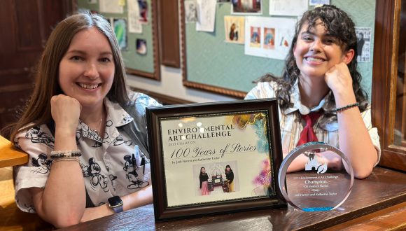 Jodi and Katherine with their Environmental Art Challenge certificate and plaque