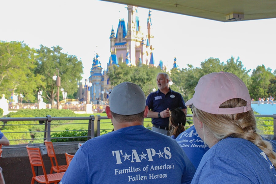 TAPS members sit outside Cinderella Castle