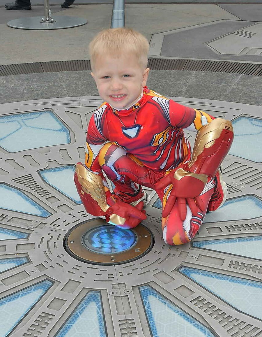 Colton poses in his Iron Man costume at Avengers Campus.