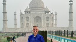 Kyle smiles in front of the Taj Mahal