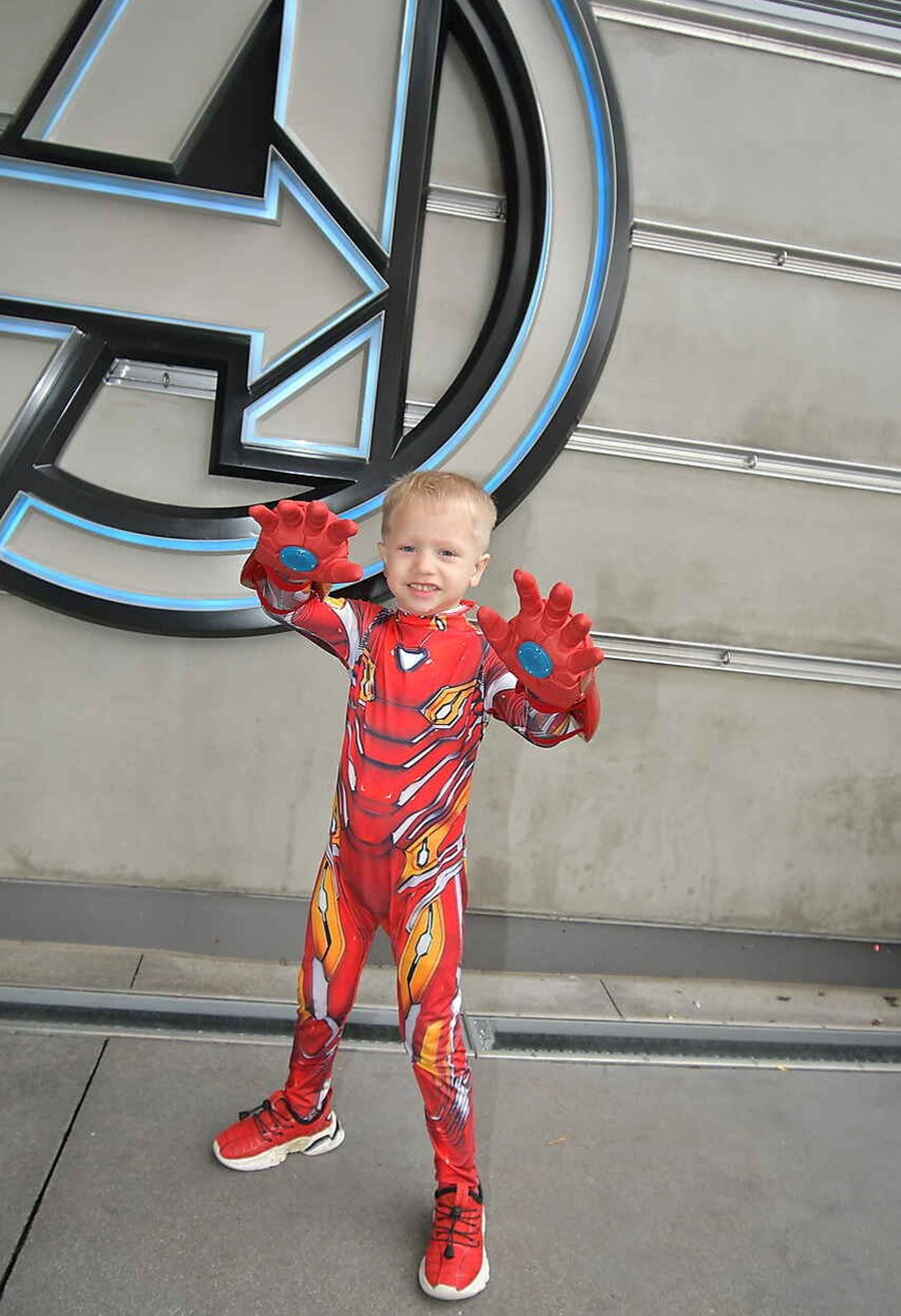 Colton poses in his Iron Man costume at Avengers Campus.