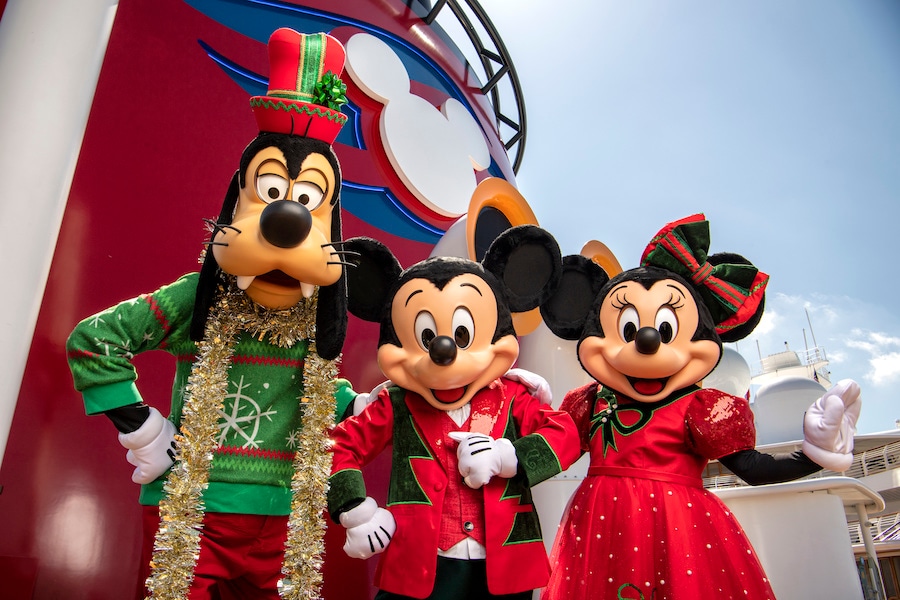 Goofy, Mickey Mouse and Minnie Mouse in holiday outfits for Disney Cruise Line's Very Merrytime Cruises