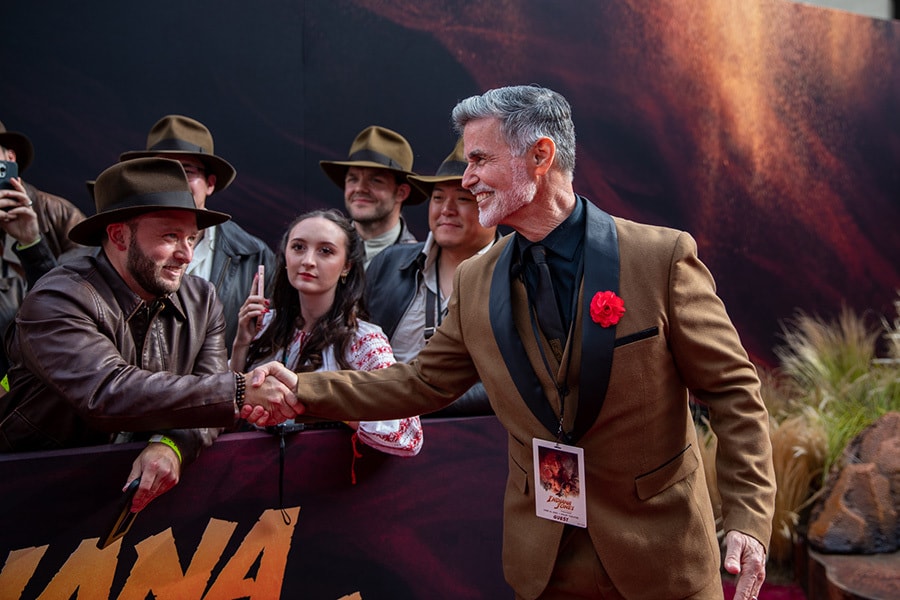 Disney Cast Member and Original Indiana Jones Epic Stunt Spectacular Indiana Jones performer meeting fans on the red carpet premiere