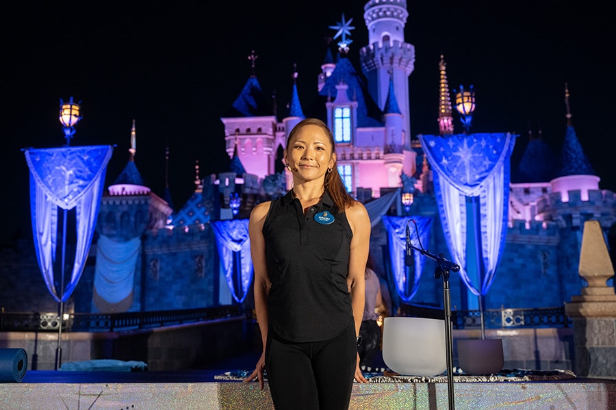 International Yoga Day instructor in front of Sleeping Beauty Castle, Disneyland
