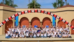 Disney VoluntEARS from Disneyland Resort, celebrating with balloons