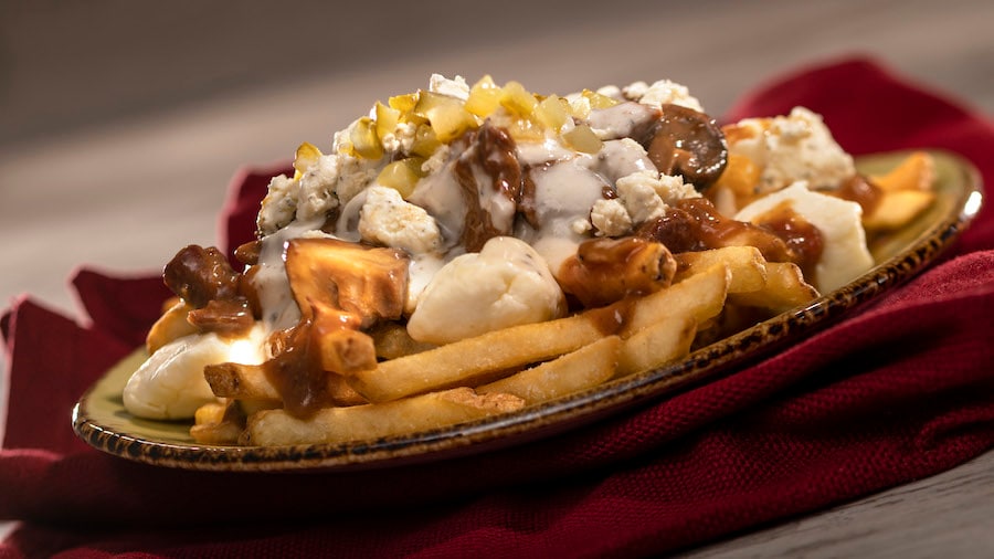 Braised Beef Poutine: French fries with braised beef, Boursin Garlic & Fine Herbs cheese sauce, cheese curds, crumbled Boursin Garlic & Fine Herbs, and gherkin relish