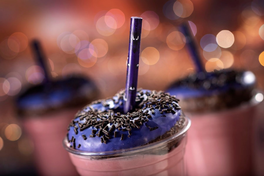 Happy Haunts Shake at Columbia Harbor House inside Magic Kingdom Park: Blackberry shake topped with purple chocolate-glazed doughnut covered with black sprinkles.