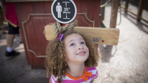 Best Roller Coasters for Kids at Disney Parks - image of small child at Magic Kingdom Park