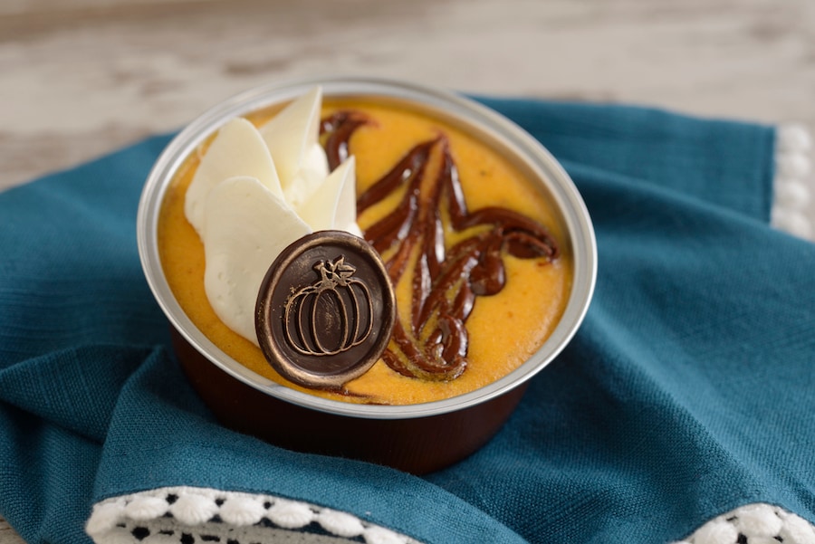 Pumpkin-Hazelnut-Chocolate Swirl Cheesecake: Pumpkin cheesecake with hazelnut-chocolate swirl, vanilla whipped panna cotta, and a milk chocolate pumpkin coin - Primo Piatto in Disney’s Riviera Resort (Available Sept. 1 through Nov. 24; mobile order available) 