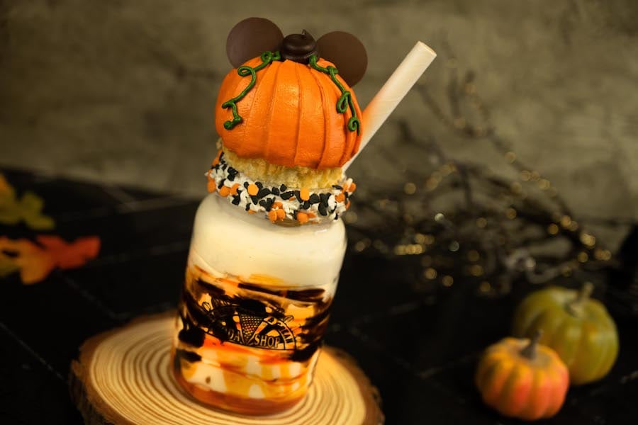 Butter Pecan-Pumpkin Shake: Butter pecan ice cream with pumpkin flavoring, caramel and chocolate sauces, and a vanilla cupcake decorated like a Mickey pumpkin with sprinkle décor at Walt Disney World in Disney’s Beach Club Resort