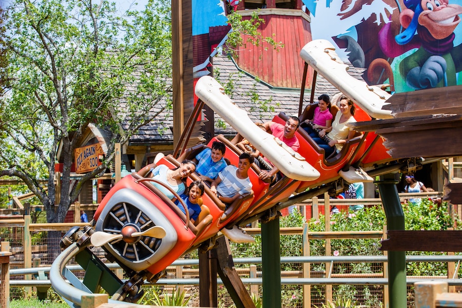 Best Roller Coasters for Kids at Disney Parks - image of small child and parent at Magic Kingdom Park on roller coaster
