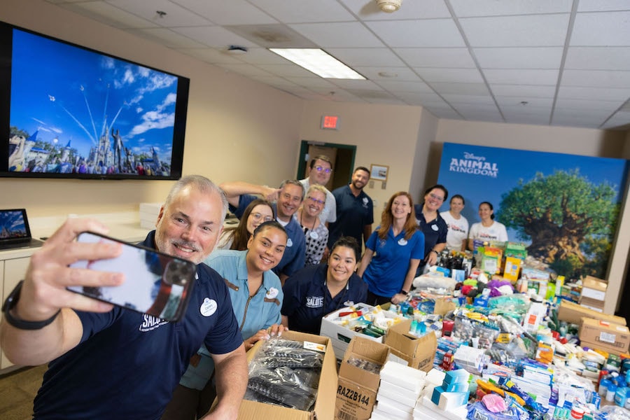 SALUTE VoluntEARS take a selfie together while preparing care packages