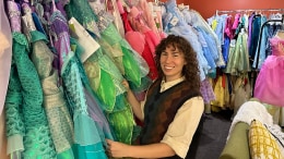 Ariella Hendrix in front of costumes