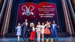 Beyan Tse and Gisele Abejero posing with Mickey and Minnie Mouse, the 2022-2023 HKDL Ambassador Team Lily and Tony, and the Ambassador program leaders during the 2024-2025 Ambassador announcement ceremony