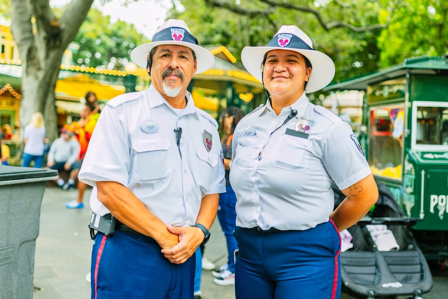 Two Security cast members standing in New Orleans Square at Disneyland park