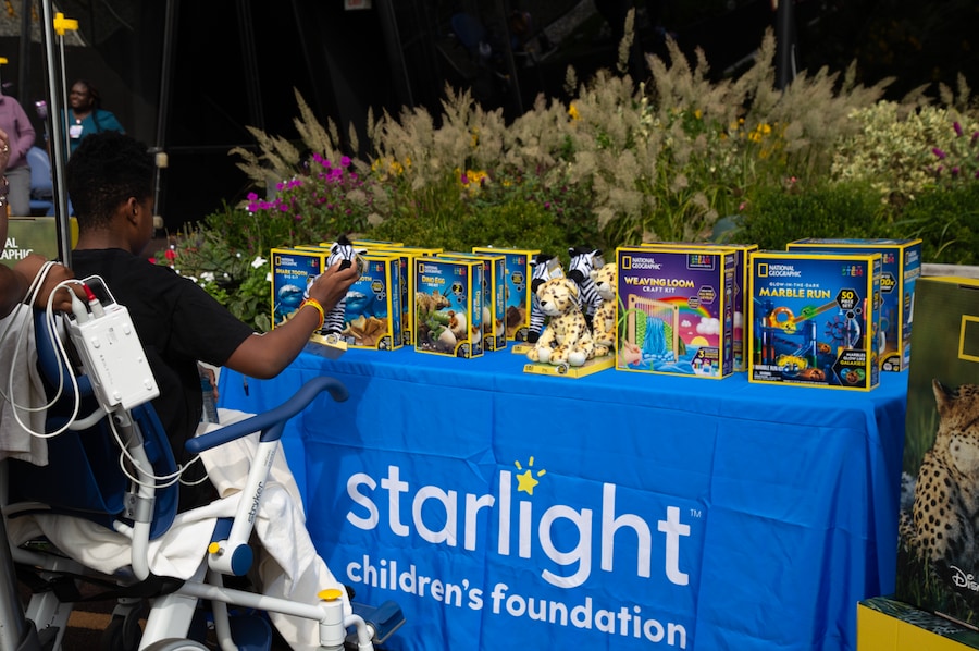 Starlight Children’s Foundation table shown -- Disney, National Geographic bringing the joy of exploration (toys and books) to children in hospitals