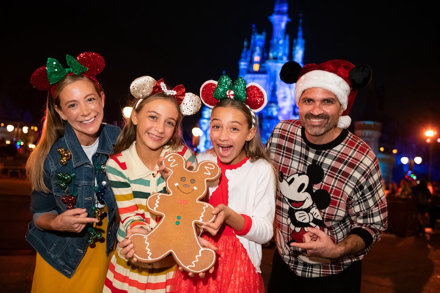 Festive Disney PhotoPass photo ops with Mickey gingerbread at Mickey’s Very Merry Christmas Party at Magic Kingdom in Walt Disney World Resort