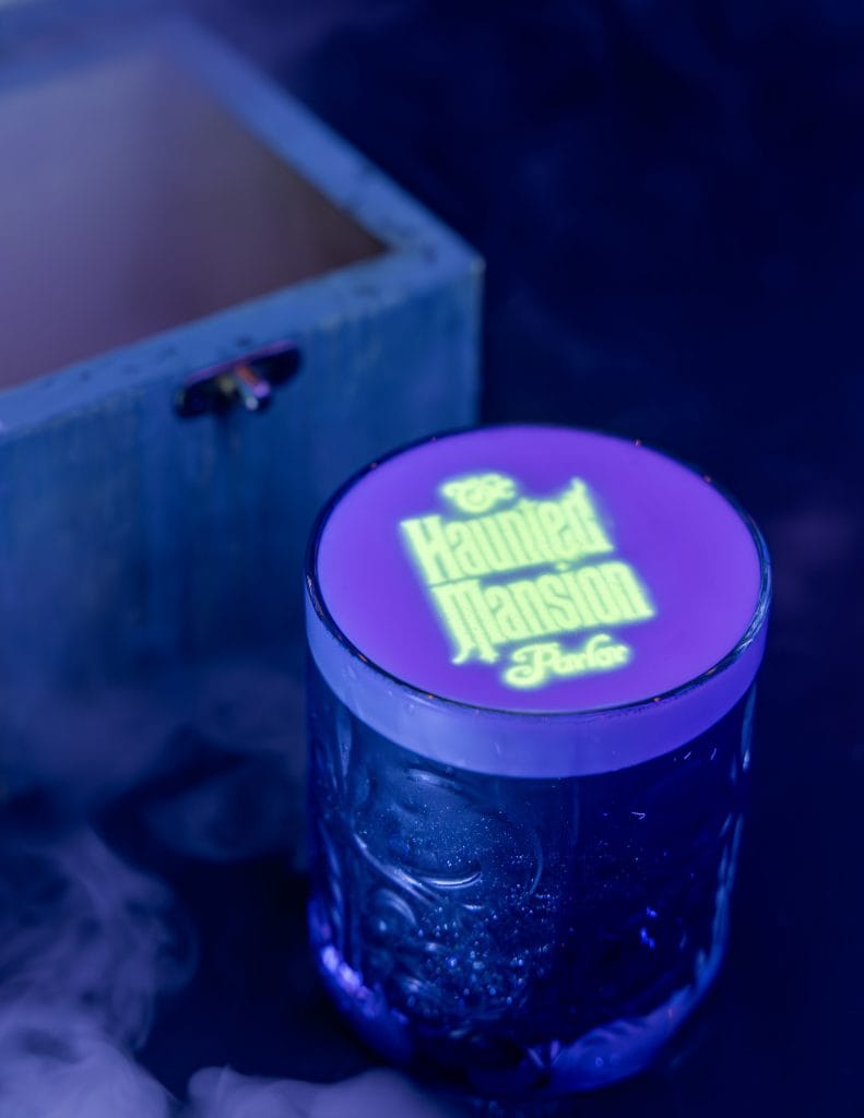 Signature Beverage, a new haunted mansion alcoholic cocktail featuring black light hidden message coming to the Haunted Mansion bar on Disney Cruise Line's newest ship the Disney Treasure