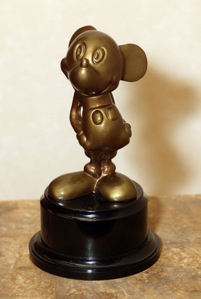 Close-up of a bronze statue of Mickey Mouse
