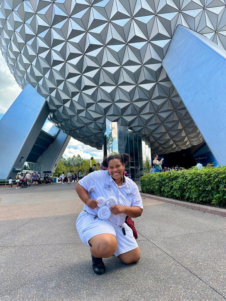 Dye smiles in front of Spaceship Earth