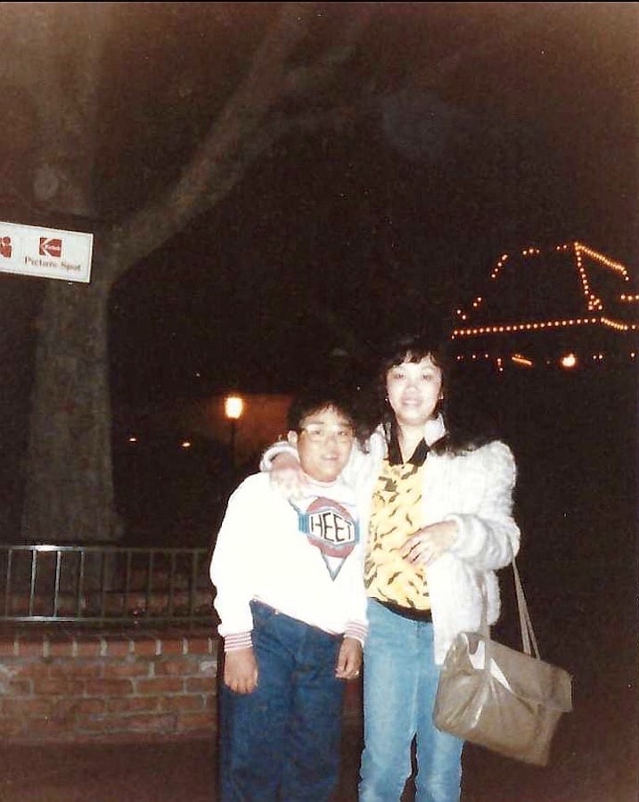 Kachain with his mom at Disneyland Resort in 1987