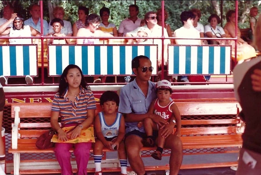 Kachain visiting the Disneyland Resort with his family in 1982.