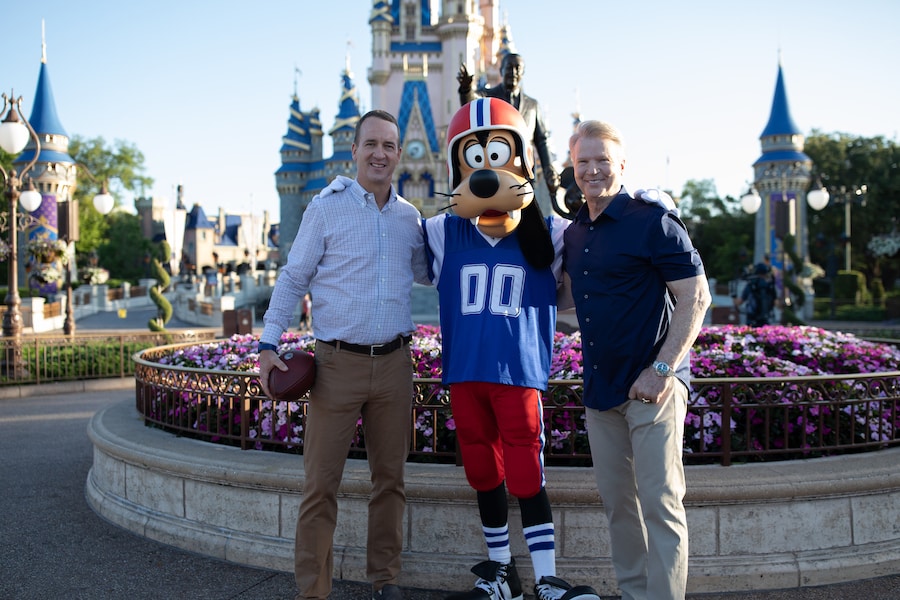 Peyton Manning and Phil Simms with Goofy at Walt Disney World, Magic Kingdom Park Hosts Special ESPN+ Peyton’s Places Look at ‘What’s Next?’ History