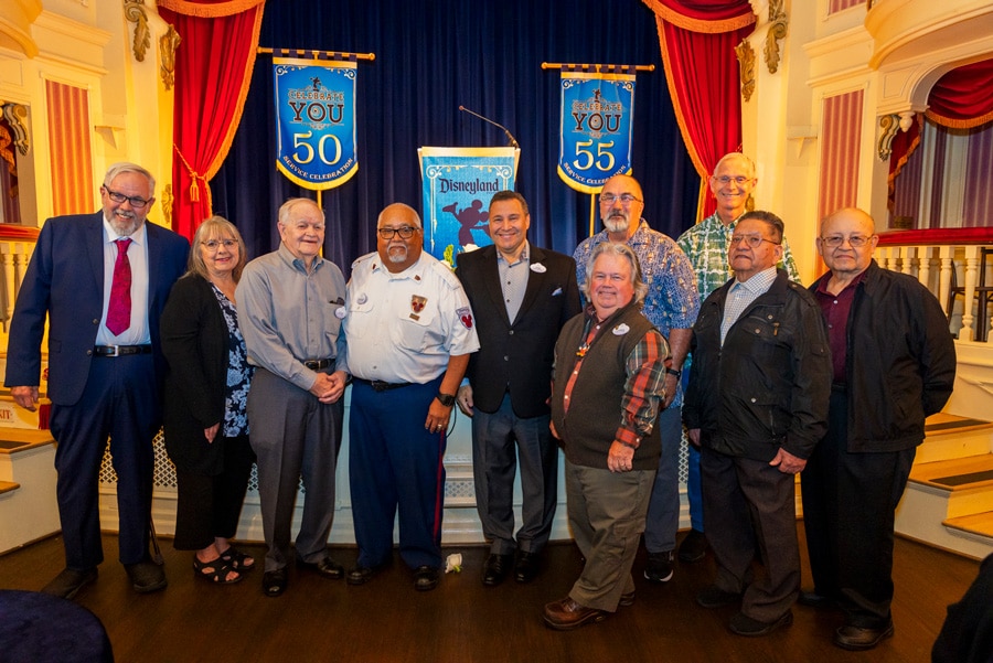 A group of cast members being honored for milestone service celebrations