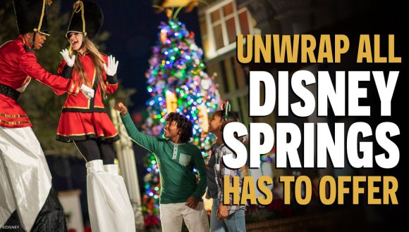 family at disney springs in a holiday themed vibe with a unwrap all disney springs has to offer