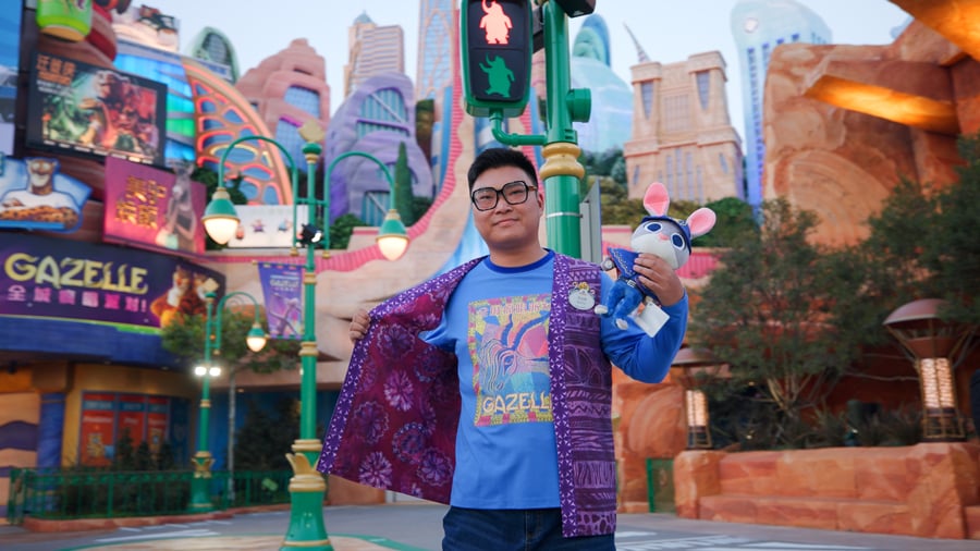 Image of cast member modeling new Zootopia costume while holding Judy Hops plush toy and wearing Gazelle concert t-shirt at Shanghai Disney Resort- First Look: Zootopia Cast Member Costumes