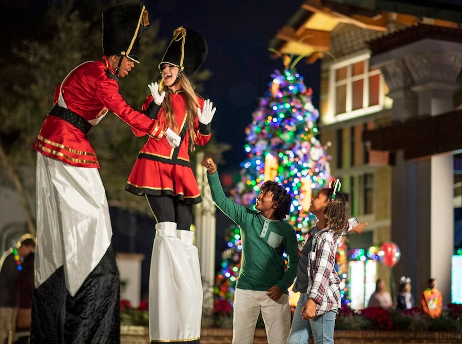 Holiday stilt walkers at Disney Springs