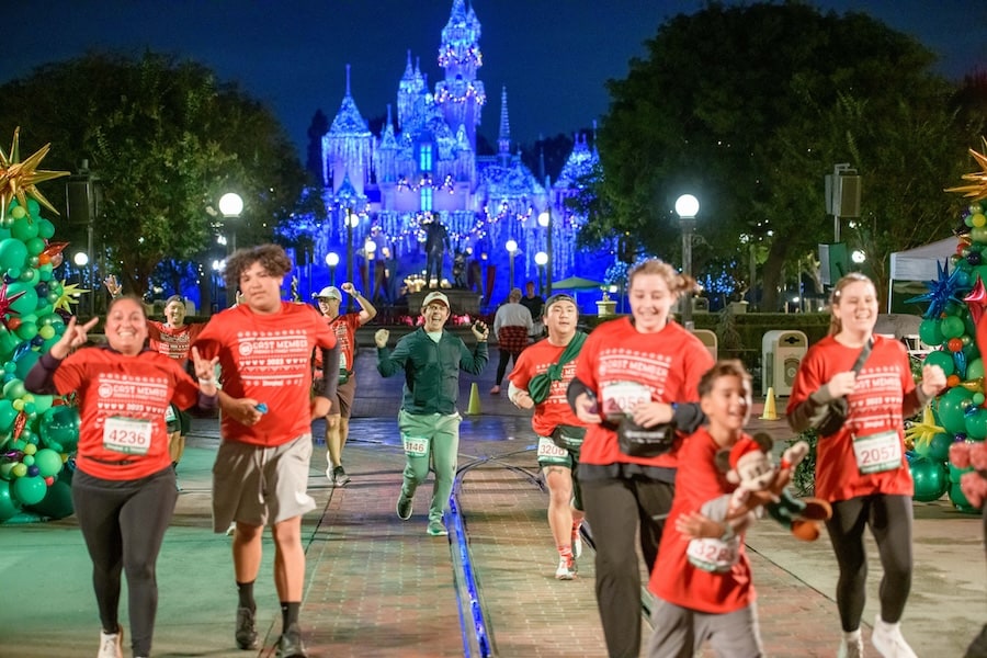 Cast members running though Magic Kingdom during the Be Well...Cast Member, Friends & Family Holiday 5K