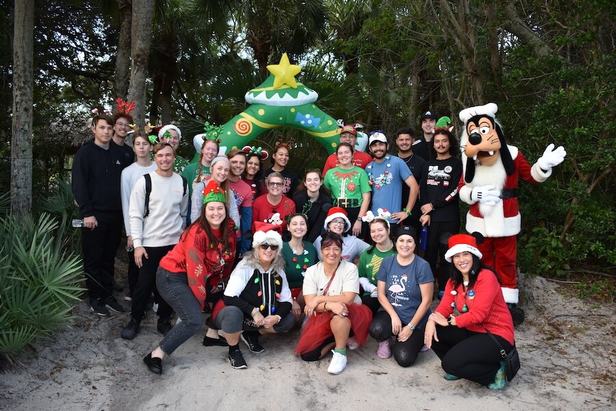 Cast members with Santa Goofy during the 2023 Be Well...Cast Member, Friends & Family Holiday 5K at Disney's Vero Beach 