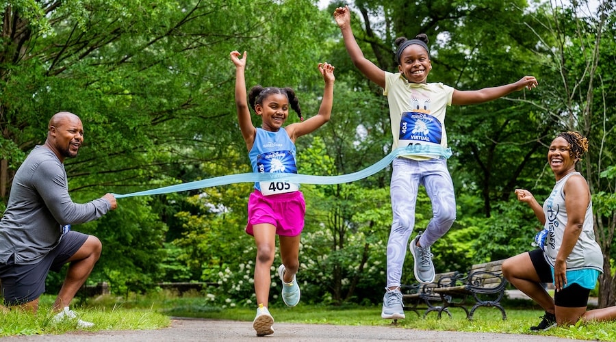 Kids running in a Virtual runDisney race in a park