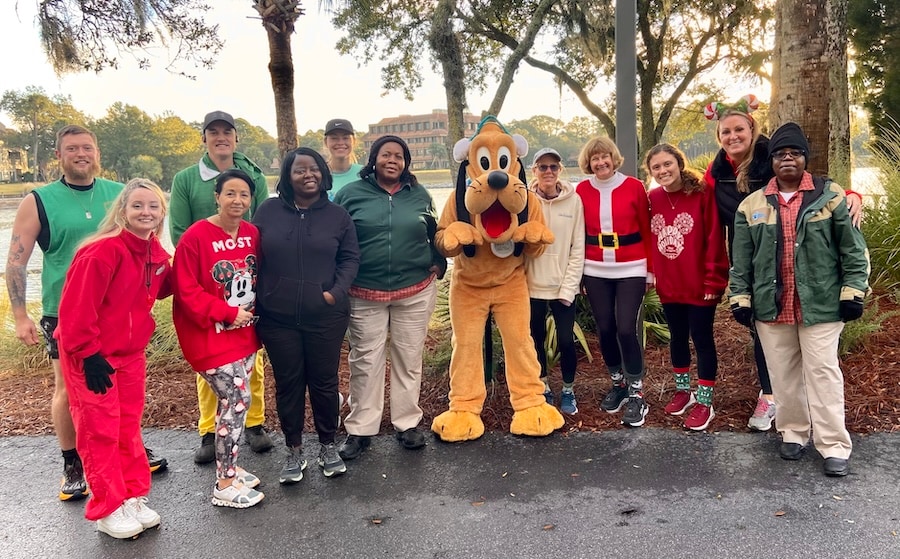 Cast members with Pluto during the 2023 Be Well...Cast Member, Friends & Family Holiday 5K at Disney’s Hilton Head Resort