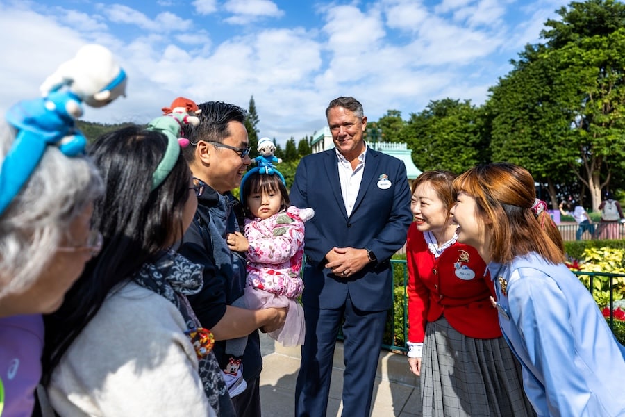 The Chen family with Michael Moriarty, Managing Director, Hong Kong Disneyland Resort, during a surprise moment when they were named the 100 millionth guest at Hong Kong Disneyland