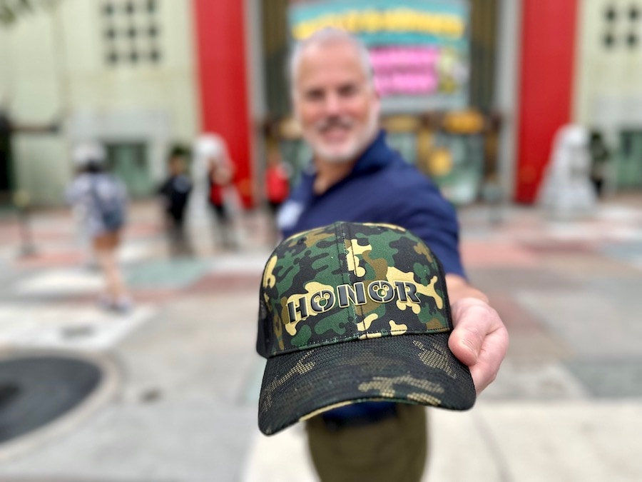 Green Camouflage hat with honor embroidered on it 