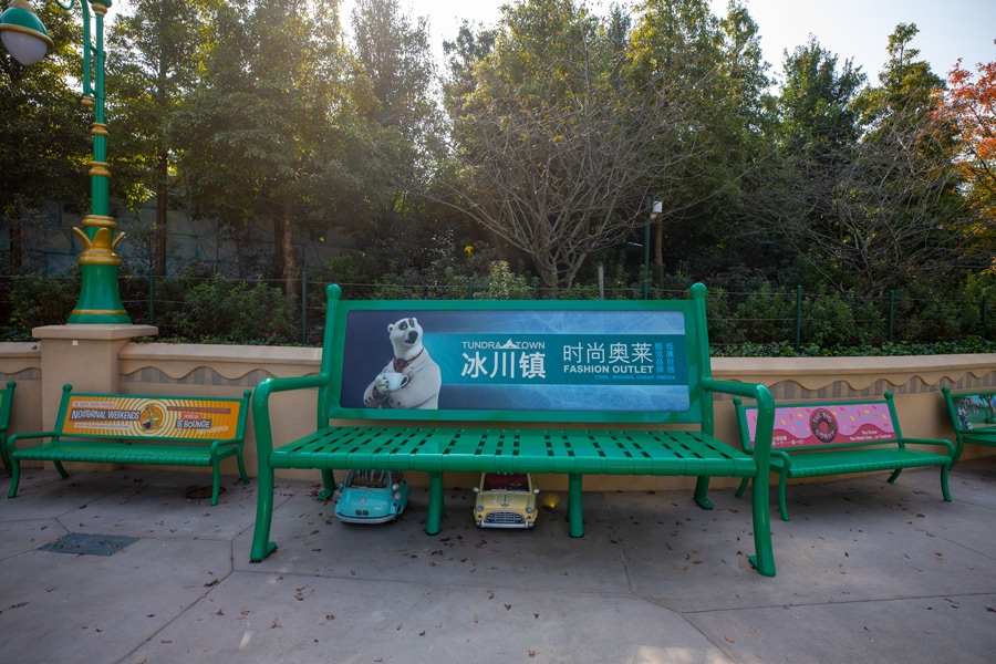 Photo of Zootopia at Shanghai Disney Resort featuring park elephant-sized benches and hidden details of small cars parked underneath park benches