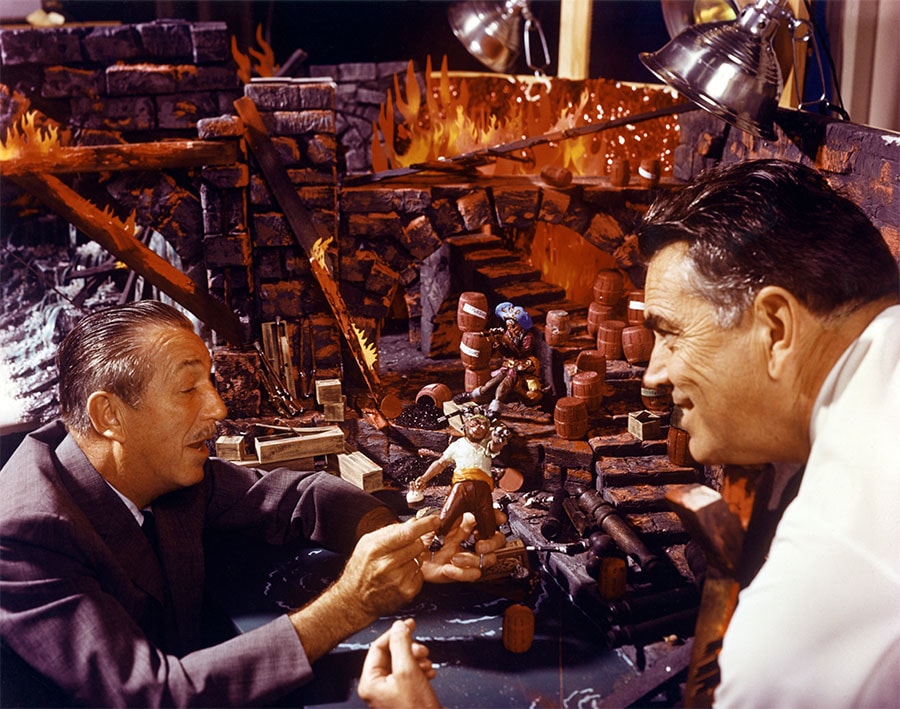 Walt Disney and an Imagineer working on the Pirates of the Caribbean ride 