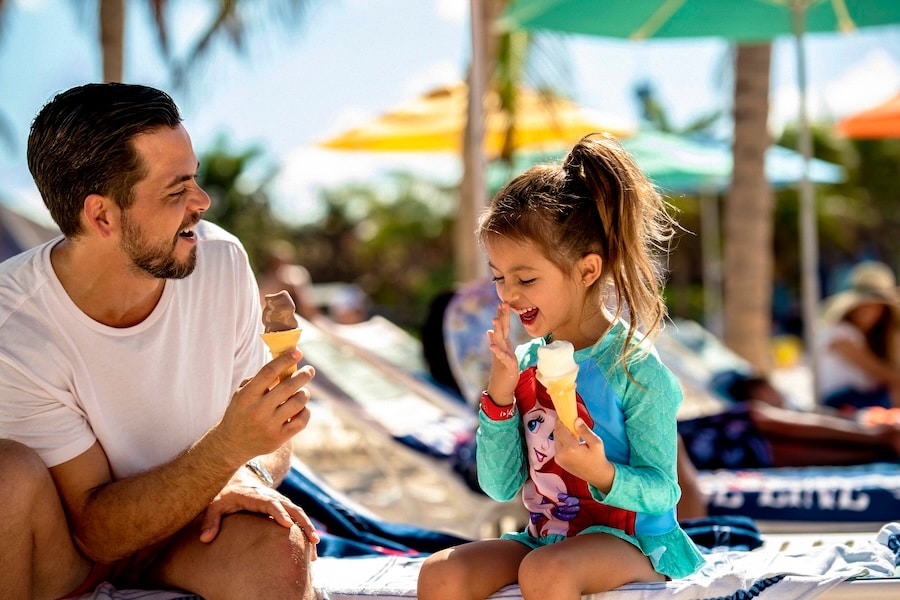 Father and daughter eating ice cream on Disney's Castaway Cay