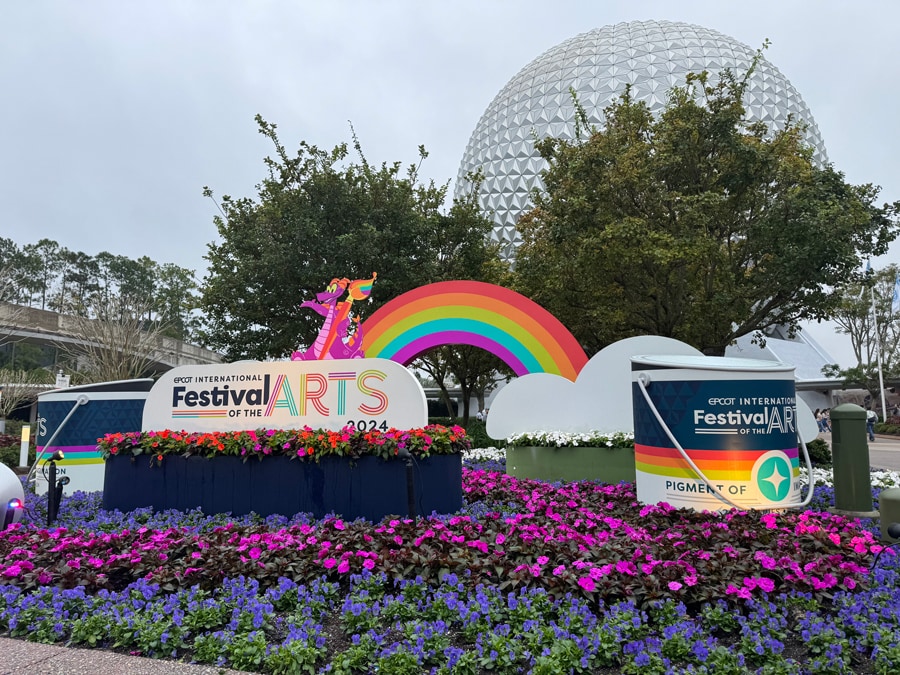 Image of EPCOT International Festival of the Arts 2024 sign entrance featuring Figment and Spaceship Earth